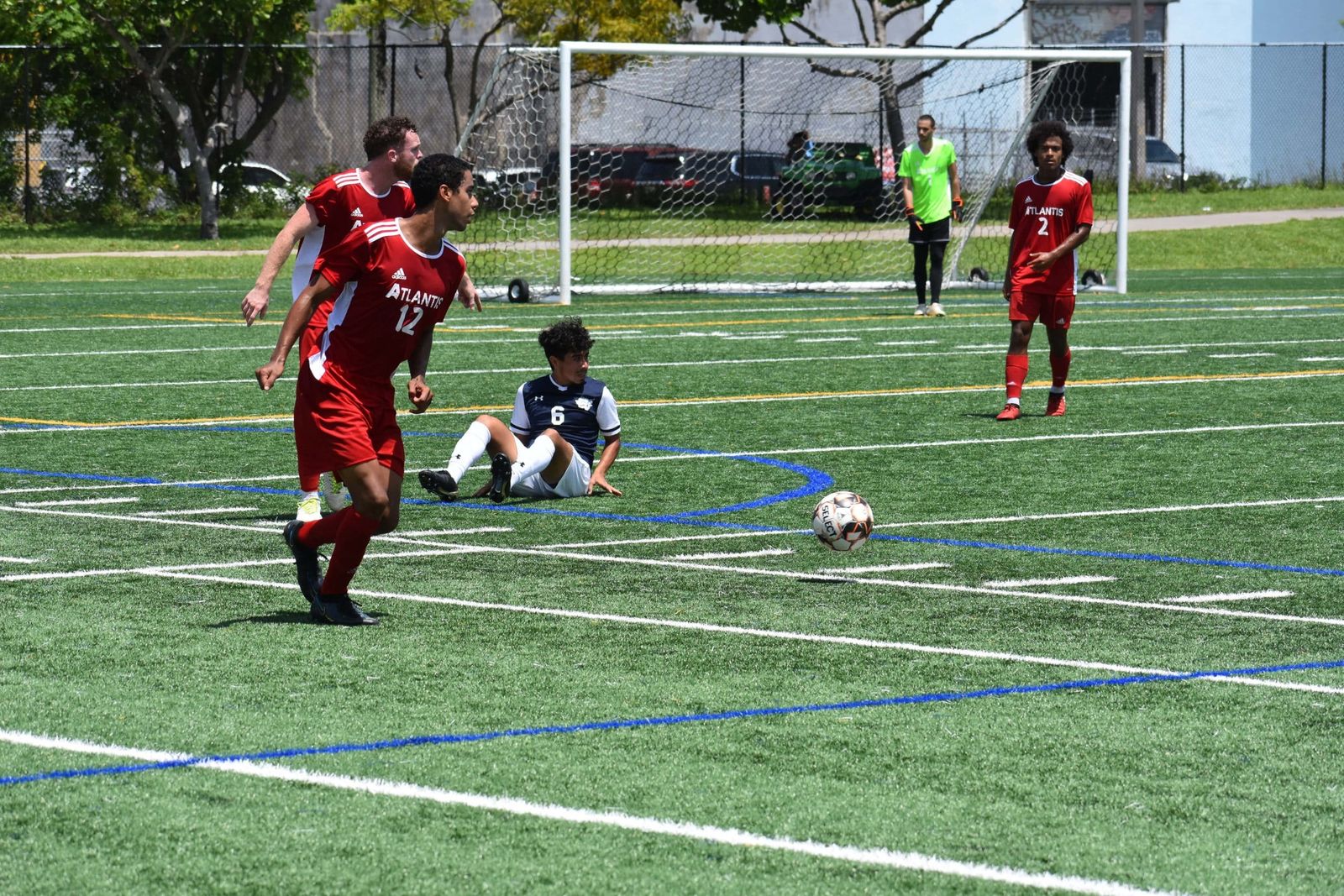 Atlantis University soccer players in action during a match