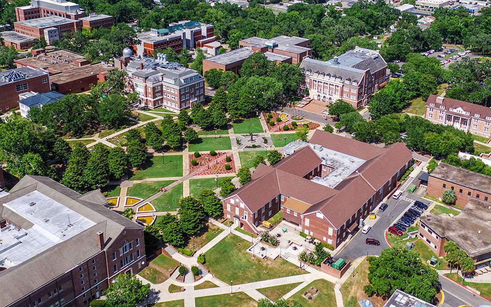 Aerial view of the Florida A&M University campus in Tallahassee, with the Quad, lawns, brick buildings and tree-lined walkways