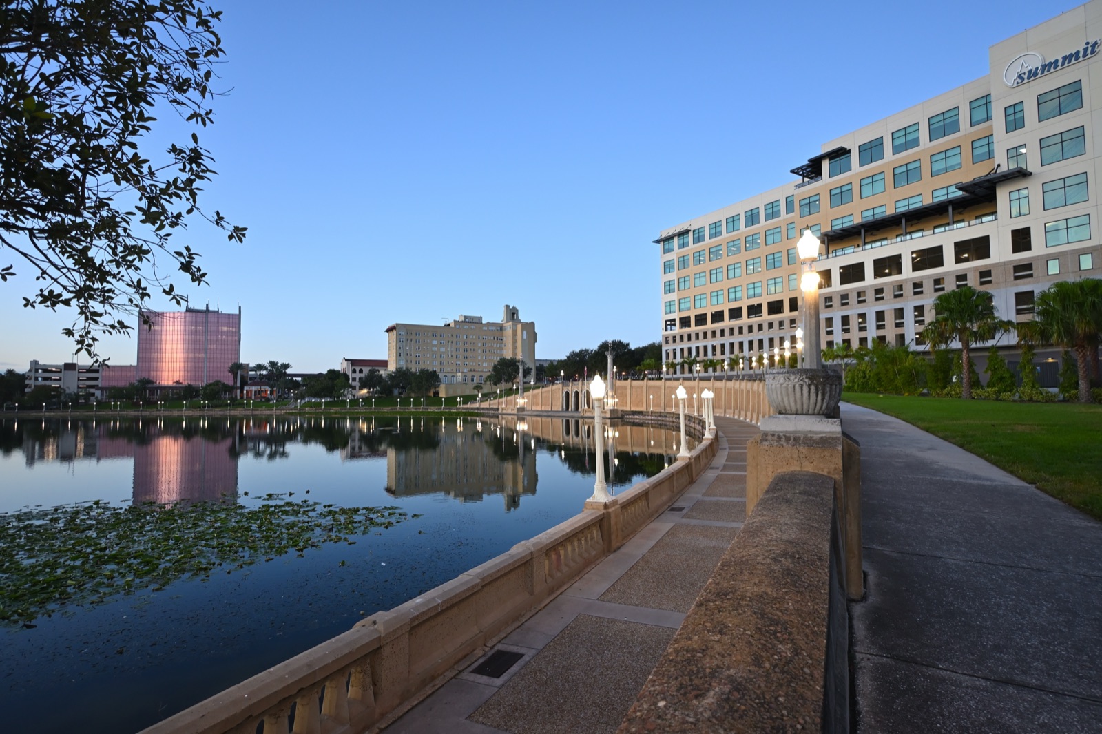 Lake Mirror Promenade in Lakeland, with its balustrade and lamp posts just before sunrise