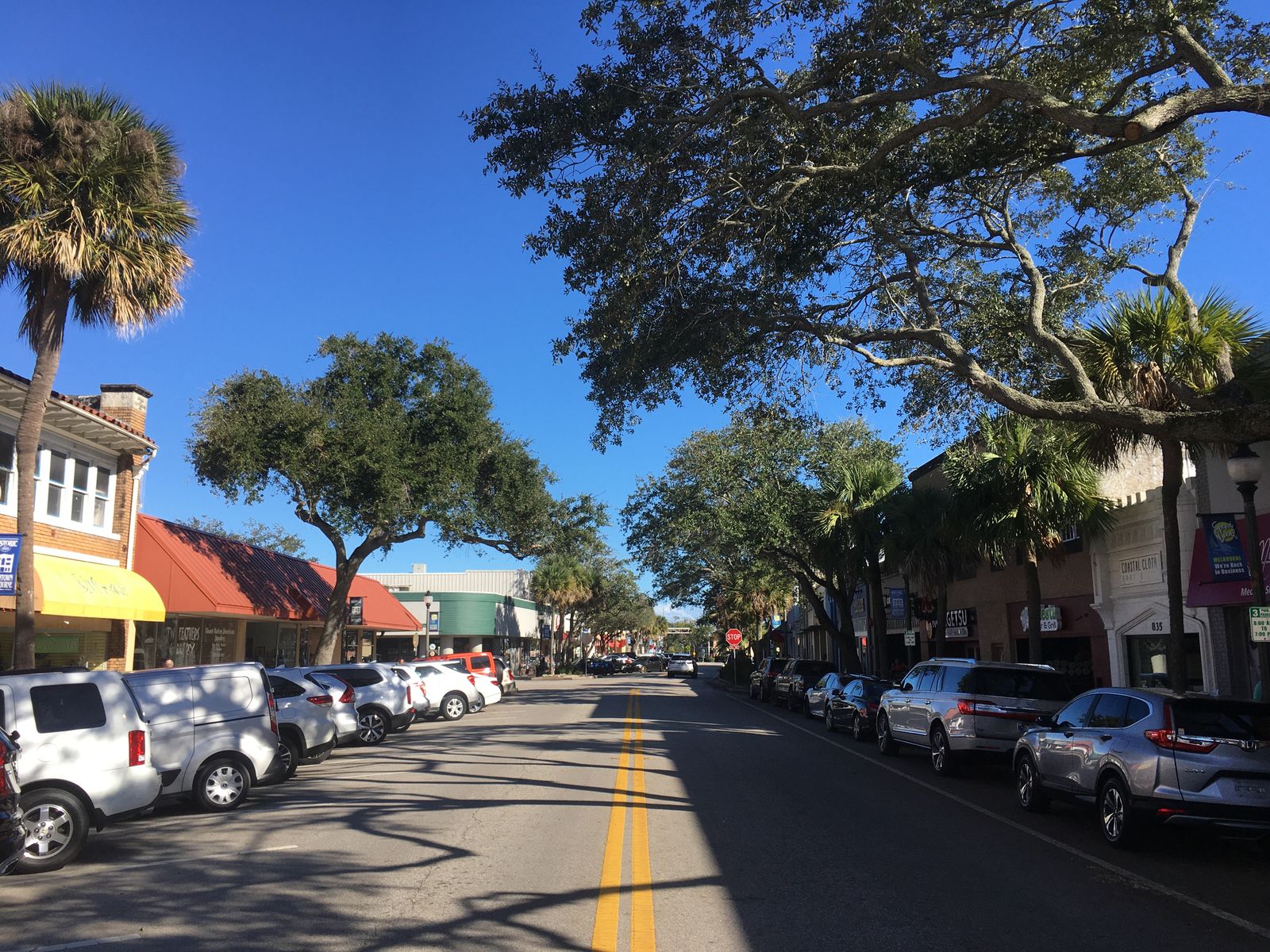 Historic downtown Melbourne, Florida: New Haven Avenue with shops, parked cars and trees