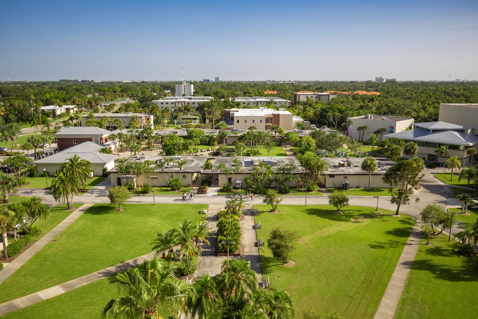 Aerial view of the Florida Tech campus in Melbourne, with lawns, palm trees and academic buildings under a clear sky