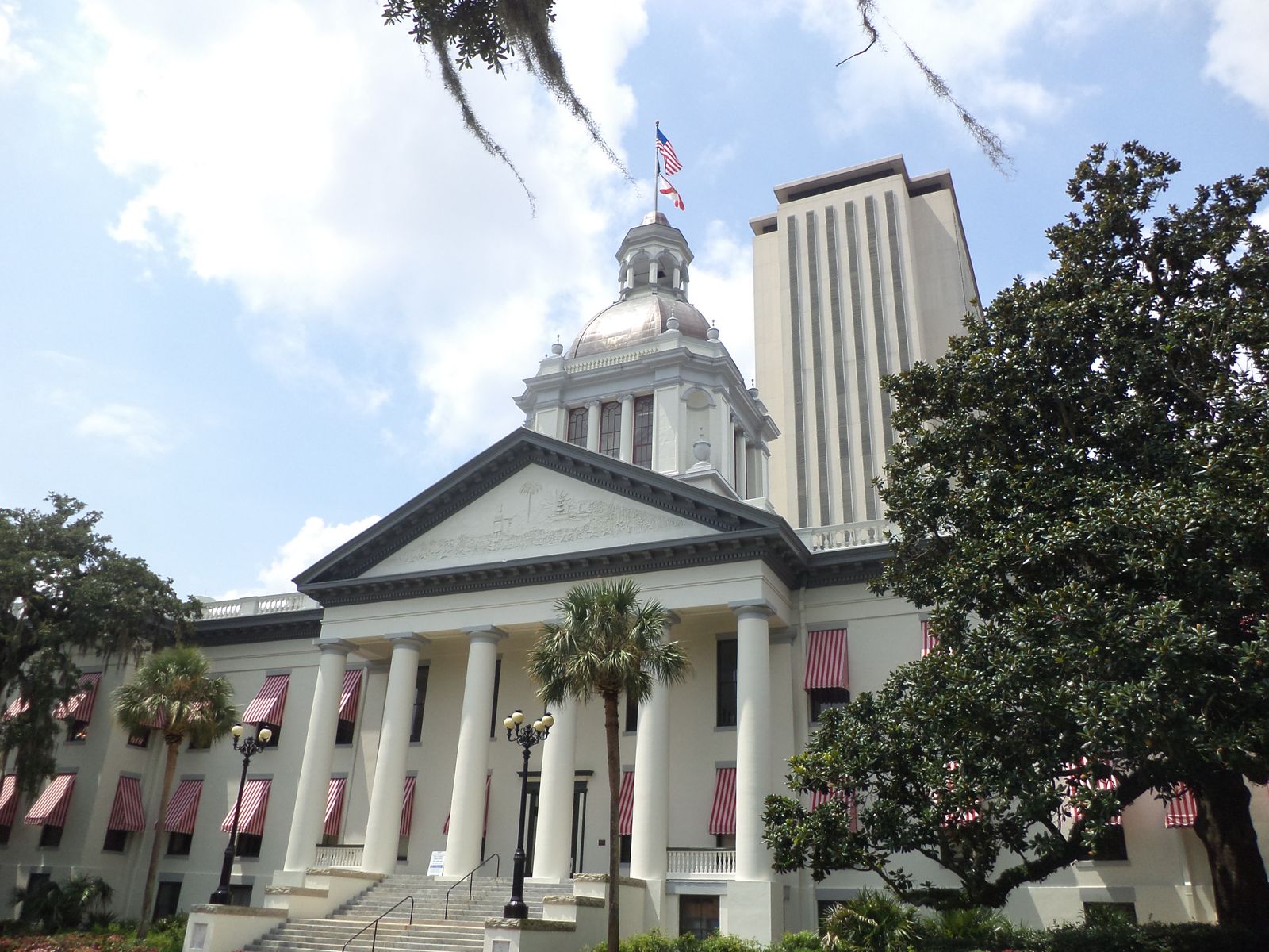 Florida's Historic Capitol, with its dome and white columns, and the state Capitol tower behind it in downtown Tallahassee