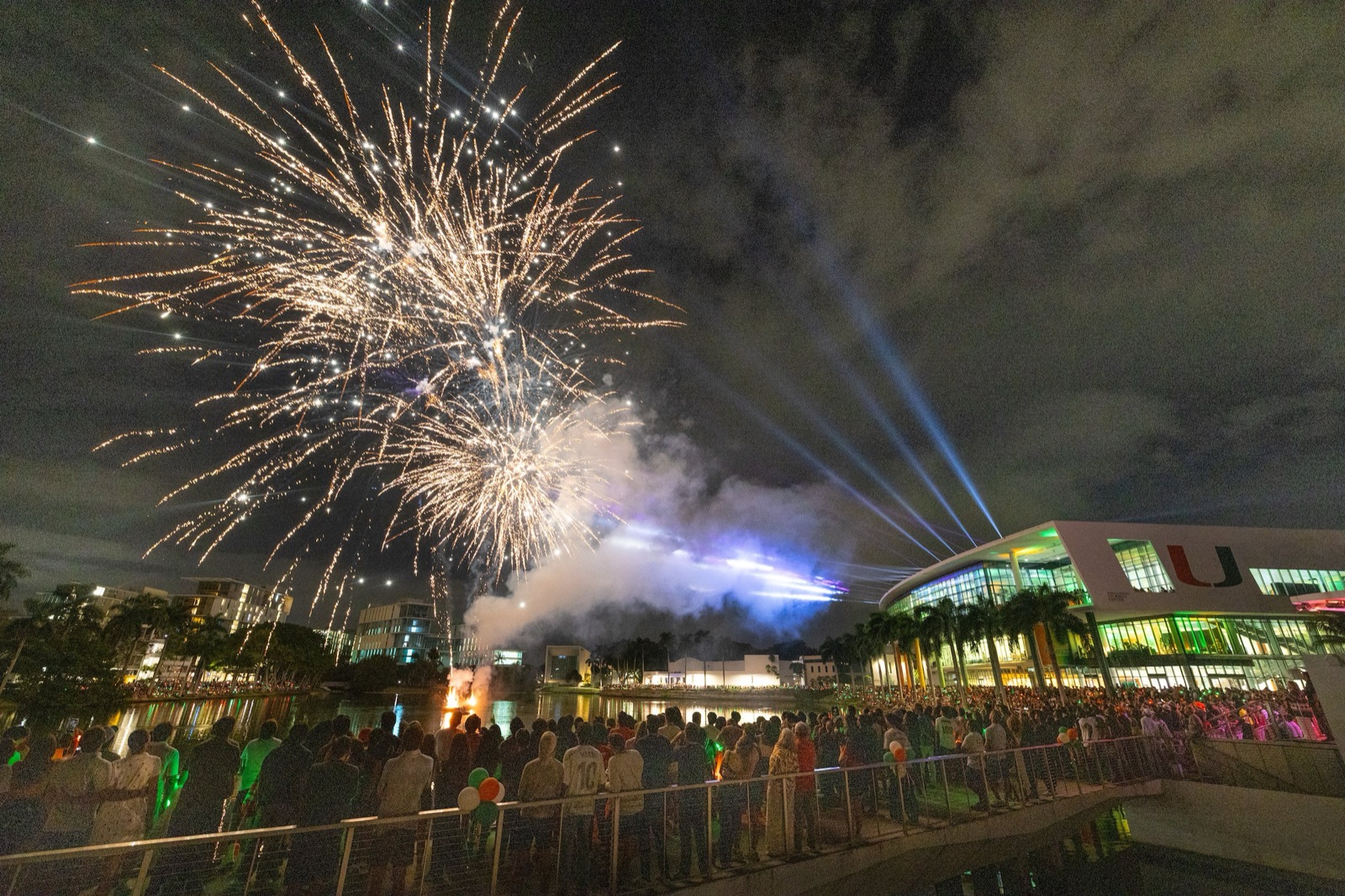 Fireworks over Lake Osceola and the University of Miami Coral Gables campus during the centennial Homecoming, crowd along the lakeshore
