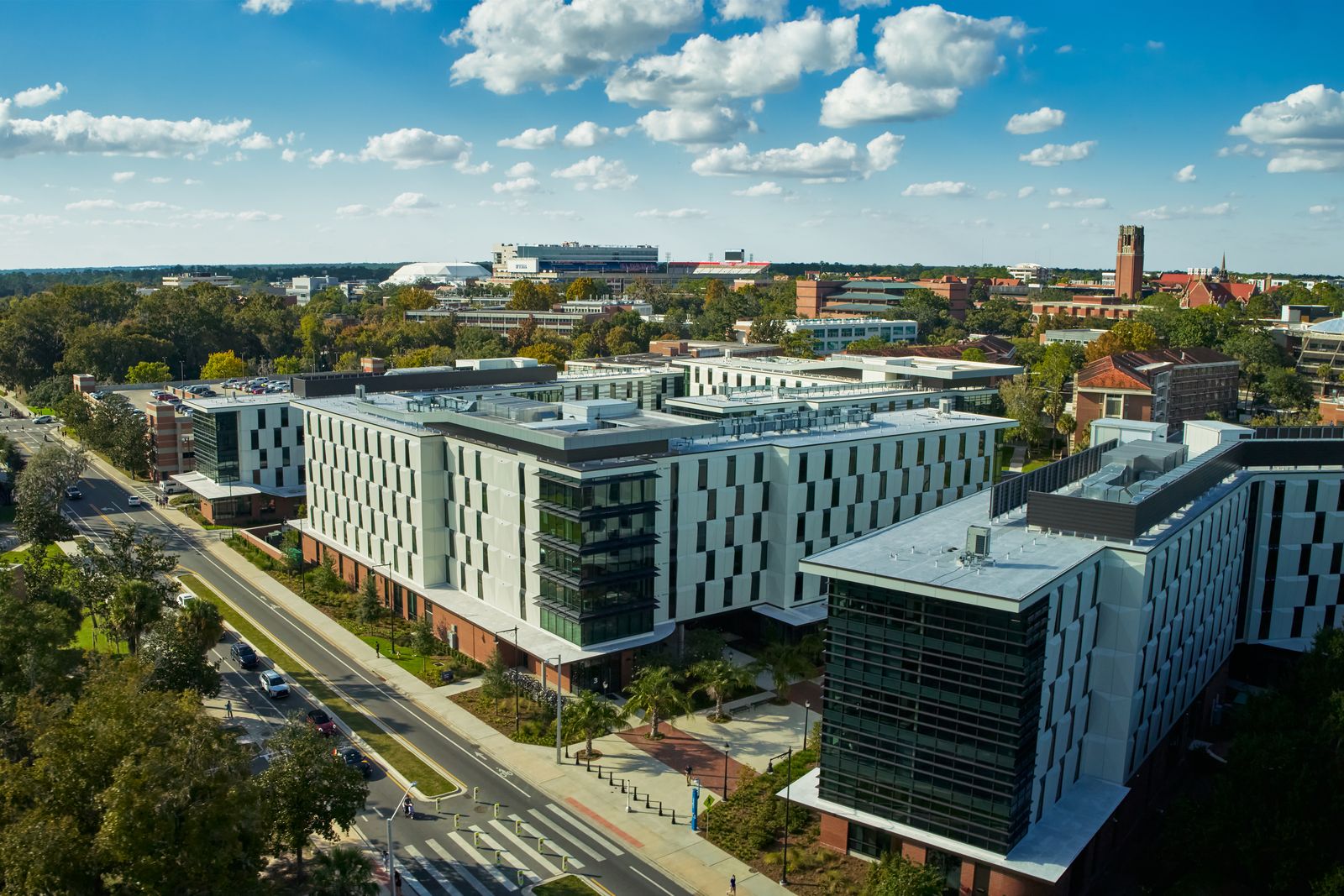 Aerial view of the Honors Village, the University of Florida's modern residence-hall complex, with glass buildings and green space