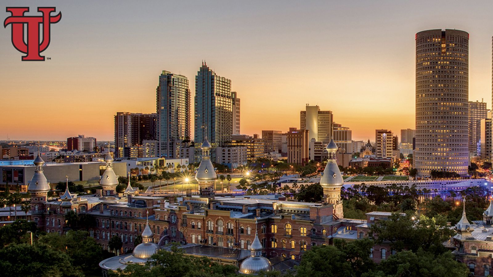 Downtown Tampa skyline at sunset, with the minarets of Plant Hall in the foreground